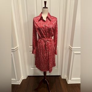 Long sleeve silky button down dress with fabric belt.